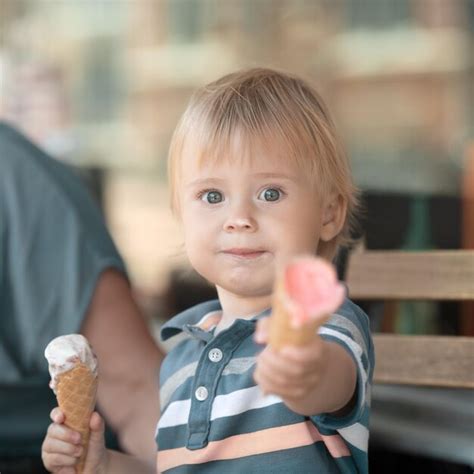 Premium Photo Portrait Of Cute Girl Holding Ice Cream Cone