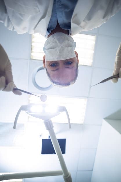 Premium Photo Female Dentist Holding Dental Tools