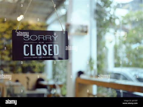 Business Coffee Cafe Shop Sign Board Is Hang On Door And Show Sorry We