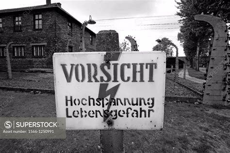 Warning sign in Auschwitz nazi concentration camp, Poland - SuperStock