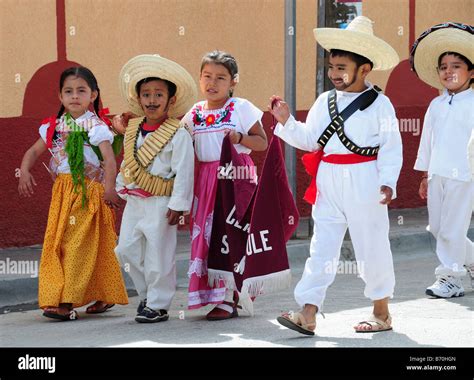 Mexican Children In National Costume Parading On Anniversary Of The