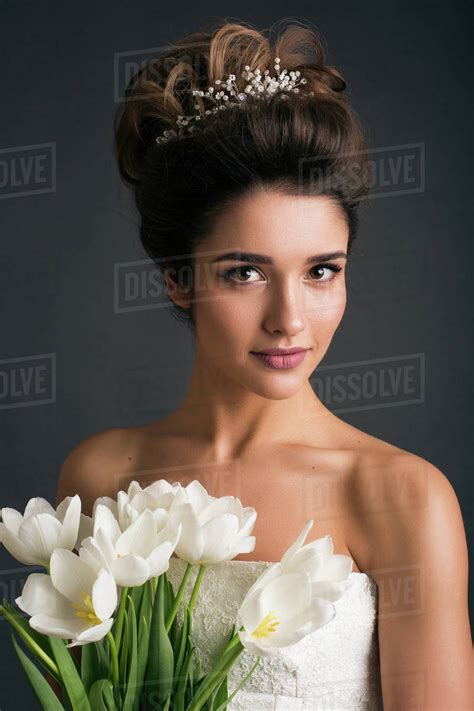 Woman Wearing Tiara Holding Tulips Stock Photo Dissolve