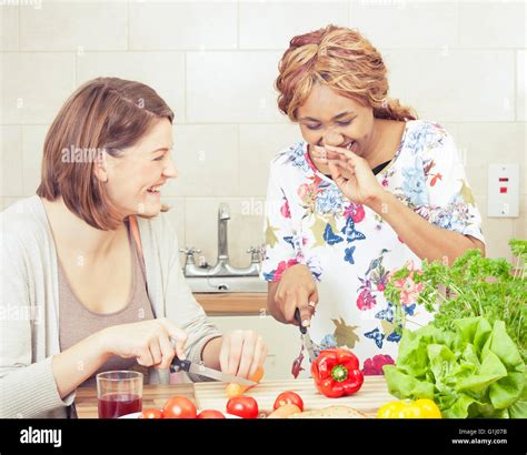 Happy Friends Cooking Together Stock Photo Alamy