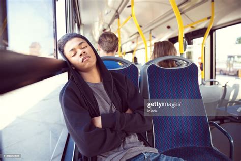 Teenage Boy Sleeping While Traveling In Bus High Res Stock Photo