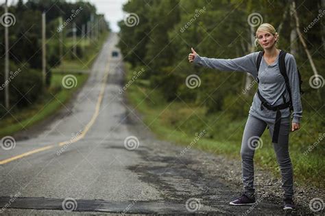 Blonde Woman Hitchhiking Stock Image Image Of Backpack 63221453