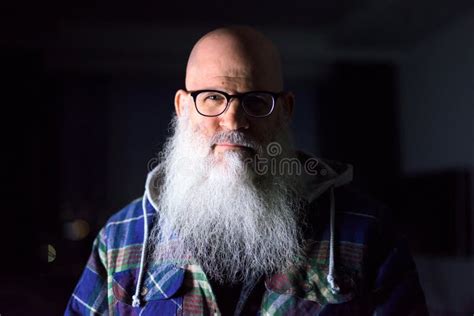 Face Of Mature Bald Bearded Hipster Man With Eyeglasses At Home In The