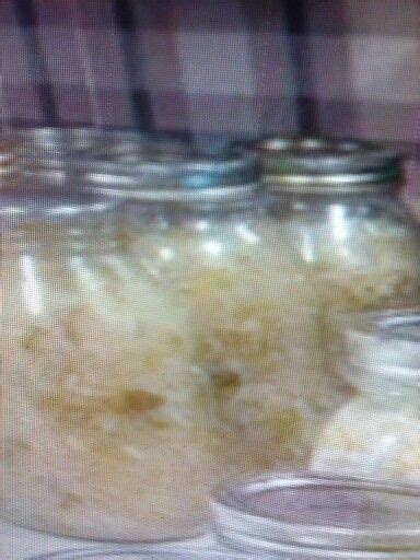 Several Jars Filled With Food Sitting On Top Of A Table