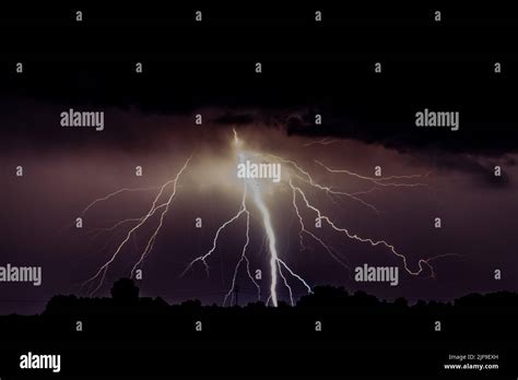 Cloud to ground lightning with copy space in the cloud Stock Photo - Alamy