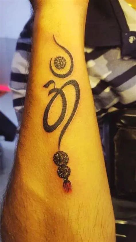 Om Tattoo On Exterior Forearm Muktha Tattoo Studio Jhaiho Om