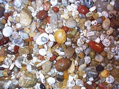 Many Different Colored Rocks And Stones On The Ground