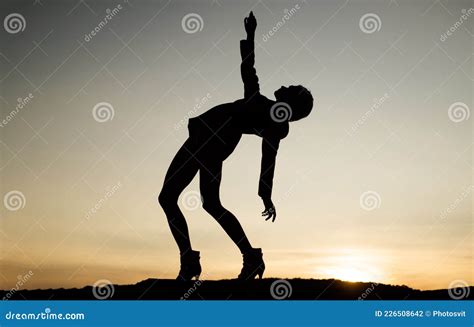 Silhouette Of A Dancing Woman Pointing In Night Sky Woman Silhouette