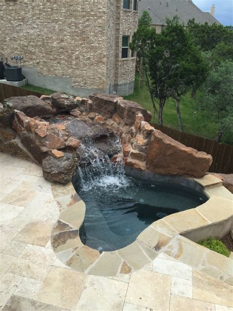 Spa With Large Rock Waterfall And Spillway Into Pond Modern