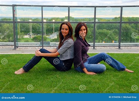 Sisters Sitting Back To Back Stock Photo Image Of Friendship Patio