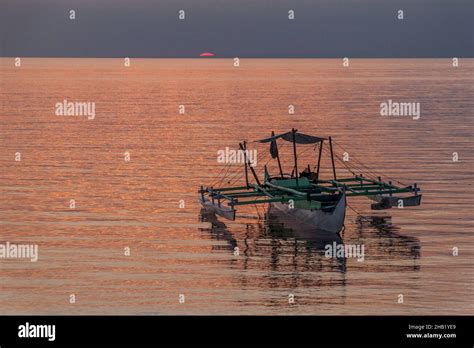 Sunset View Of A Bangka Double Outrigger Boat On Siquijor Island