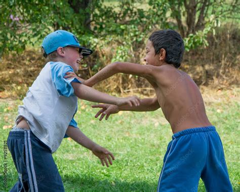Boys different race fight against each other Stock Photo | Adobe Stock