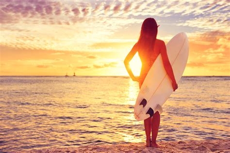 Surfer girl surfing looking at ocean beach sunset – Waterton Publishing ...