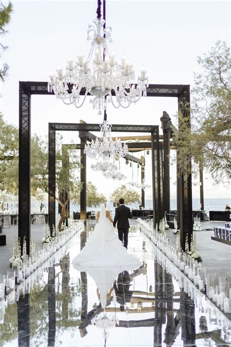 Newlyweds While Walking Down The Aisle Of Their Wedding Venue An Aisle