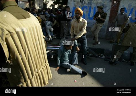 Policemen Baton Charge Government Transporters During A Protest In