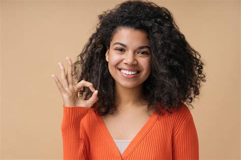 Premium Photo Smiling African American Woman Showing Ok Sign Good