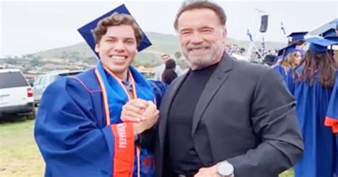 Arnold Schwarzenegger Stands Proudly Aside Son Joseph Baena During