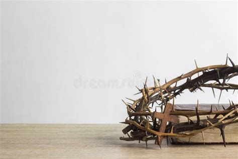 Close Up Of Crown Of Thorns Of Jesus On Top Of The Holy Bible On Wooden