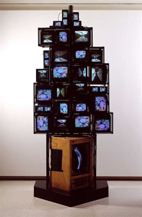 A Television Tower With Multiple Tvs Stacked On Top Of Each Other In