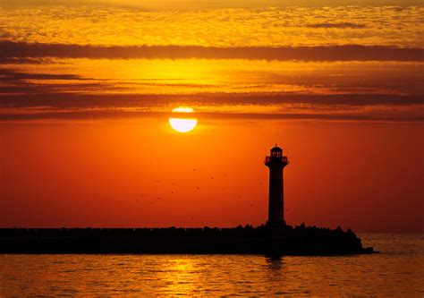 Lighthouse At Sunrise Photograph By Evgeni Ivanov Fine Art America