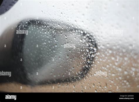 Rain Drops On Car Mirror And Window In Rainy Day Stock Photo Alamy