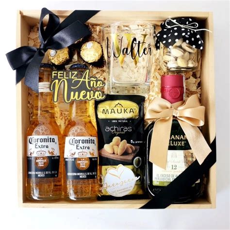 A Wine Gift Box Filled With Liquor And Snacks