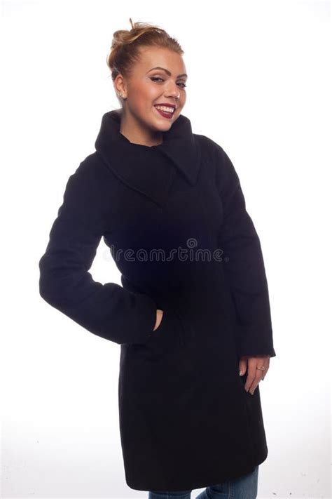 Blonde In A Black Latex Suit Put Her Foot On The Wall In A Pose Stock Photo Image Of Fetish