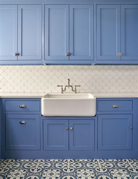 Blue Laundry Room Cabinets With White And Blue Cement Quatrefoil Tiles