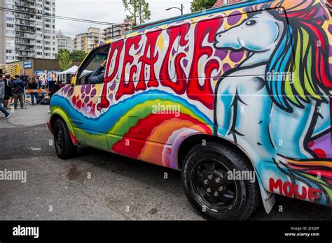 Colourfully Painted Hippie Van With Peace Message Stock Photo Alamy