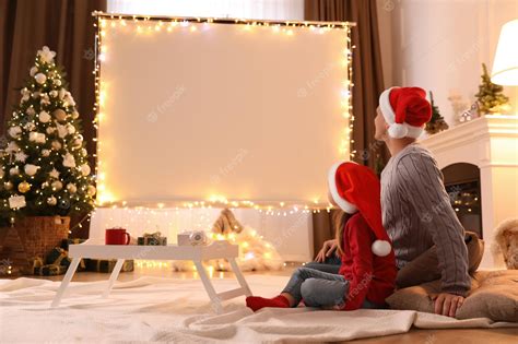 Premium Photo Father And Daughter Watching Movie Using Video