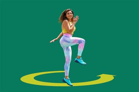 Premium Photo A Sporty Young Woman Jumping In The Air