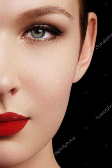 Make Up And Cosmetics Beauty Woman Face Isolated On Black Background