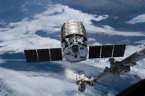 Cygnus Cargo Spacecraft Docking With Iss Photograph By Nasa Fine Art