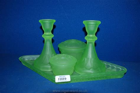 An Art Deco Uranium Glass Dressing Table Set In Frosted Green Comprising Two Candlesticks Two