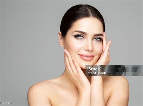 Face Skin Care Beauty Woman With Full Lips Natural Makeup Over Gray