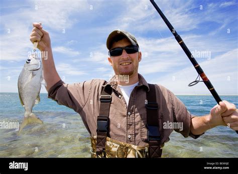 Happy Fisherman Shows Off His Catch Stock Photo Alamy