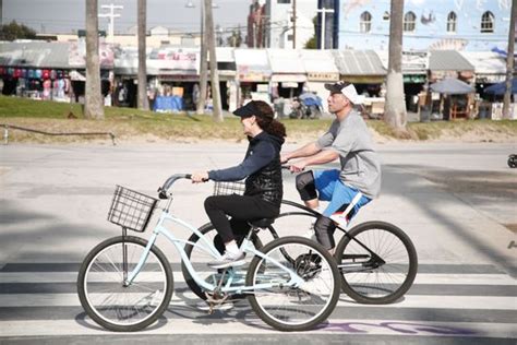 Two People Ride On Bycicles On Editorial Stock Photo Stock Image