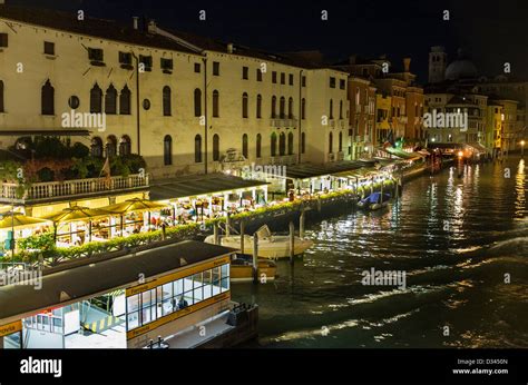 Restaurants Bordering the Grand Canal in Venice at Night Stock Photo - Alamy