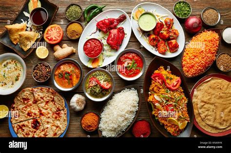 Assorted Indian Recipes Food Various With Spices And Rice On Wooden