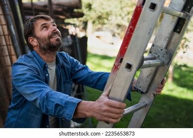 Side View Mature Man Climbing Ladder Stock Photo 2235653873 Shutterstock