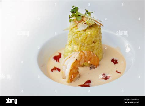 Gourmet Dish From Saffron Risotto With Vegetable And Herb Topping A