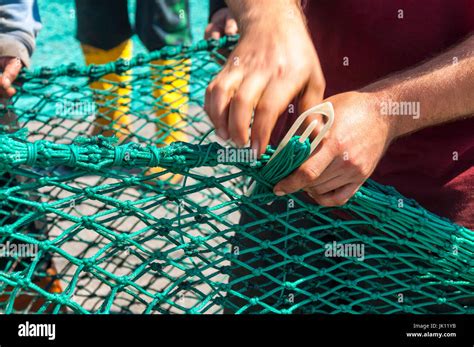 Fishermans Hands Repairing Mending Nets In Killybegs Harbour County