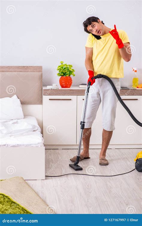 The Young Handsome Man Cleaning In The Bedroom Stock Image Image Of