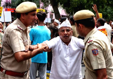 Delhi Police Detain An AAP Worker During A Protest