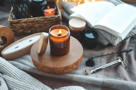 Premium Photo Burning Candle In A Festive Cozy Interior