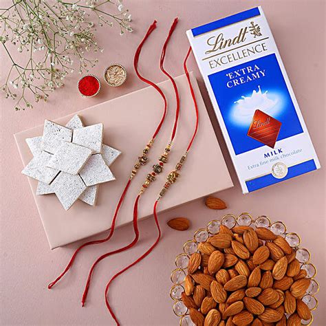 Traditional Feng Shui Rakhi Set With Lindt Bar Kaju Katli And Almonds