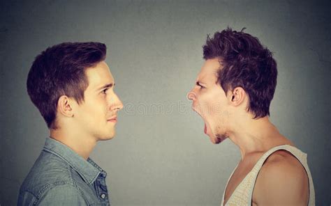 Side Profile Portrait of Young Angry Man Screaming at a Calm Smiling Guy Stock Image - Image of ...